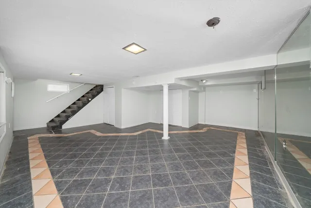 a view of an empty room with stairs