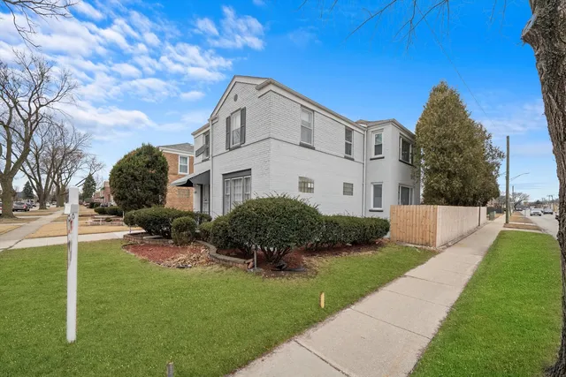 a view of a backyard with a garden and plants