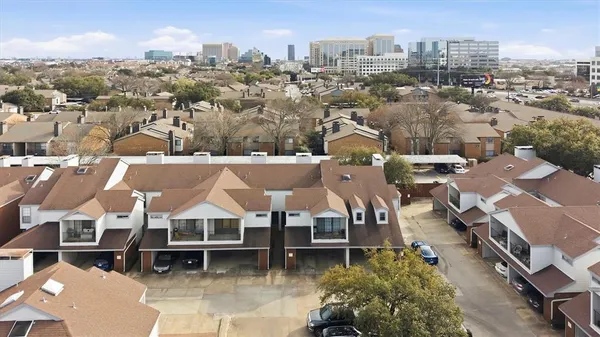 an aerial view of a house with a lot of city