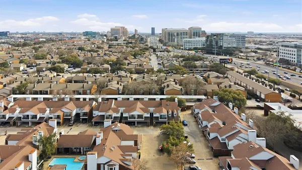 an aerial view of a city with lots of residential buildings