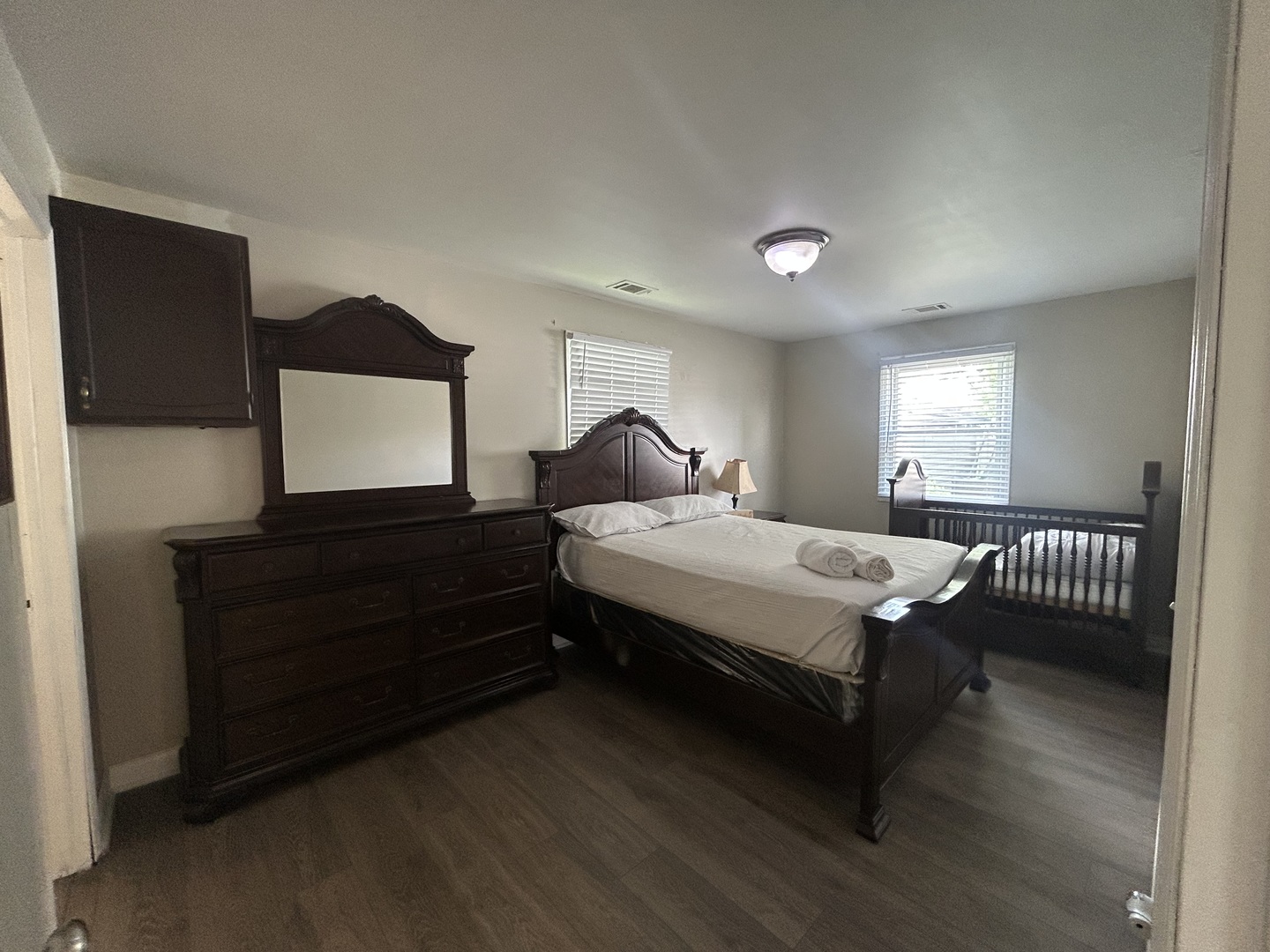 6232 Washington Street Chicago Ridge, IL 60415 - Photo 14 of 33 a bedroom with a bed and a flat tv screen on dresser