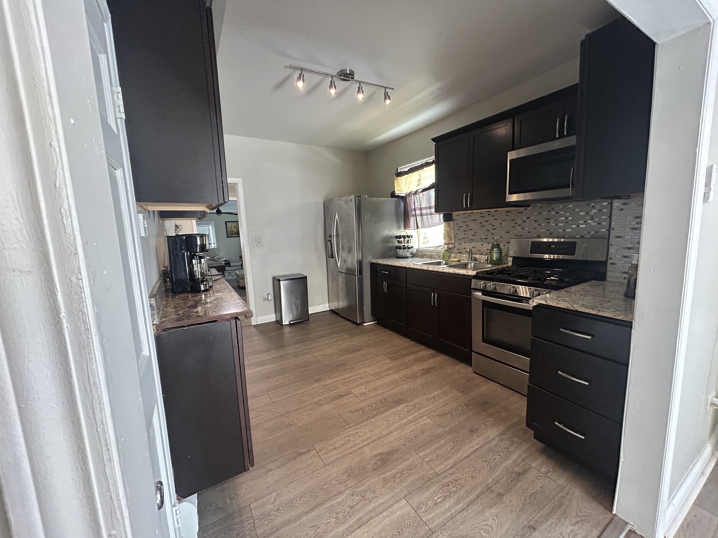 6232 Washington Street Chicago Ridge, IL 60415 - Photo 7 of 33 a kitchen with stainless steel appliances granite countertop a stove a sink and a refrigerator