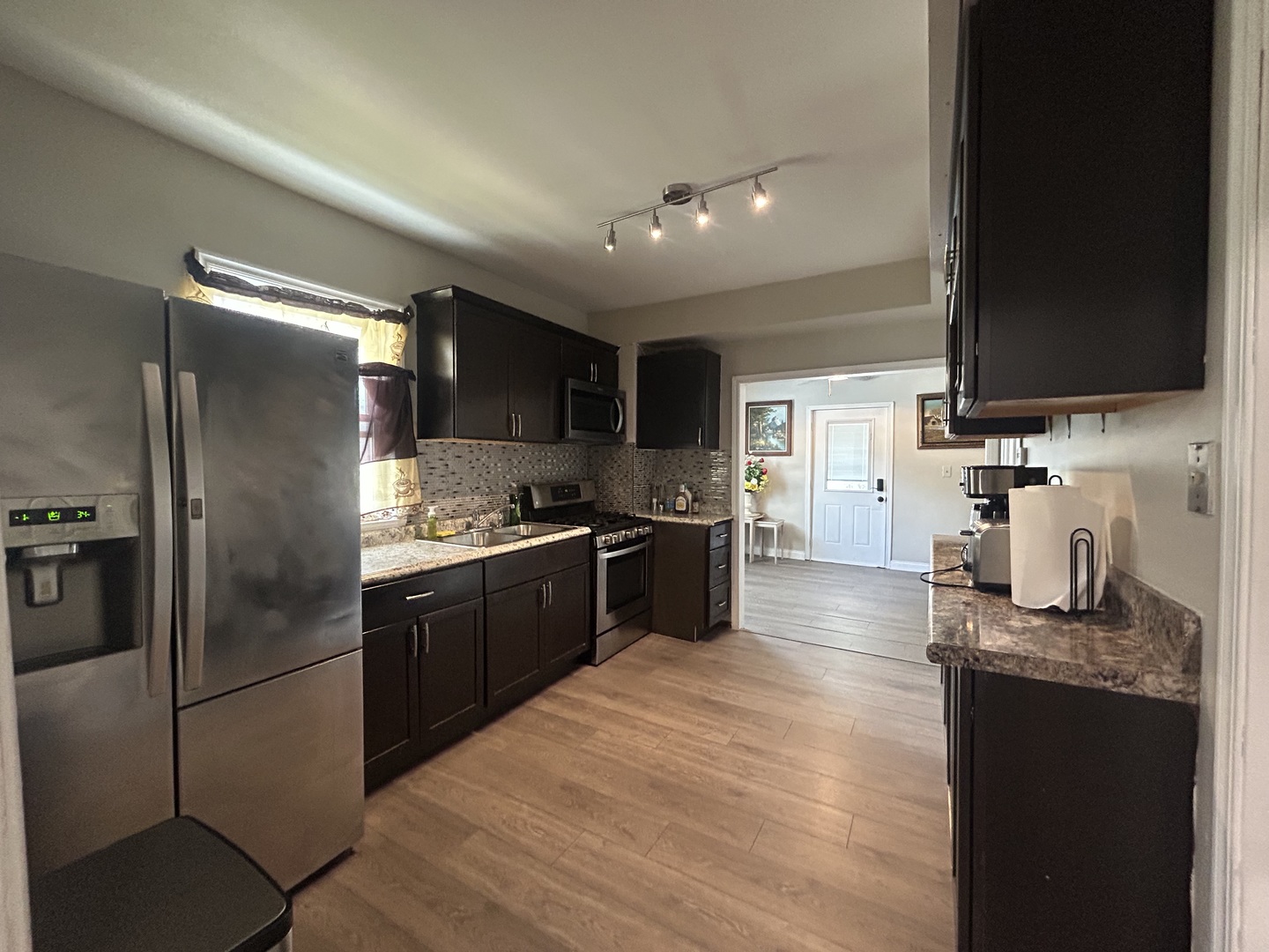 6232 Washington Street Chicago Ridge, IL 60415 - Photo 8 of 33 a large kitchen with a large counter top stainless steel appliances and cabinets