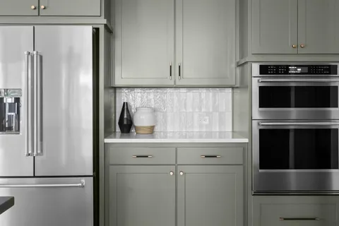a kitchen with stainless steel appliances a refrigerator and a sink