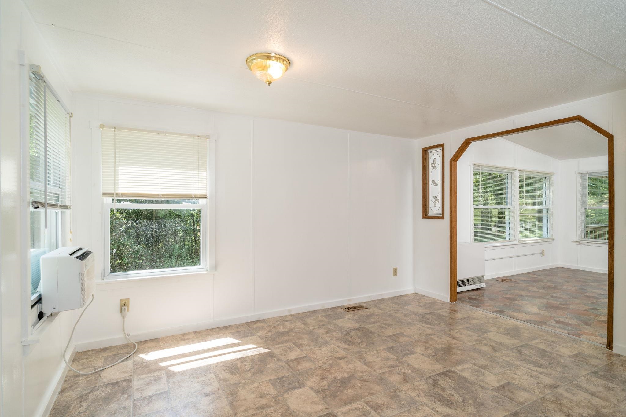 414 Bear Trap Farm Road Mount Solon, VA 22843 - Photo 8 of 40 an empty room with windows