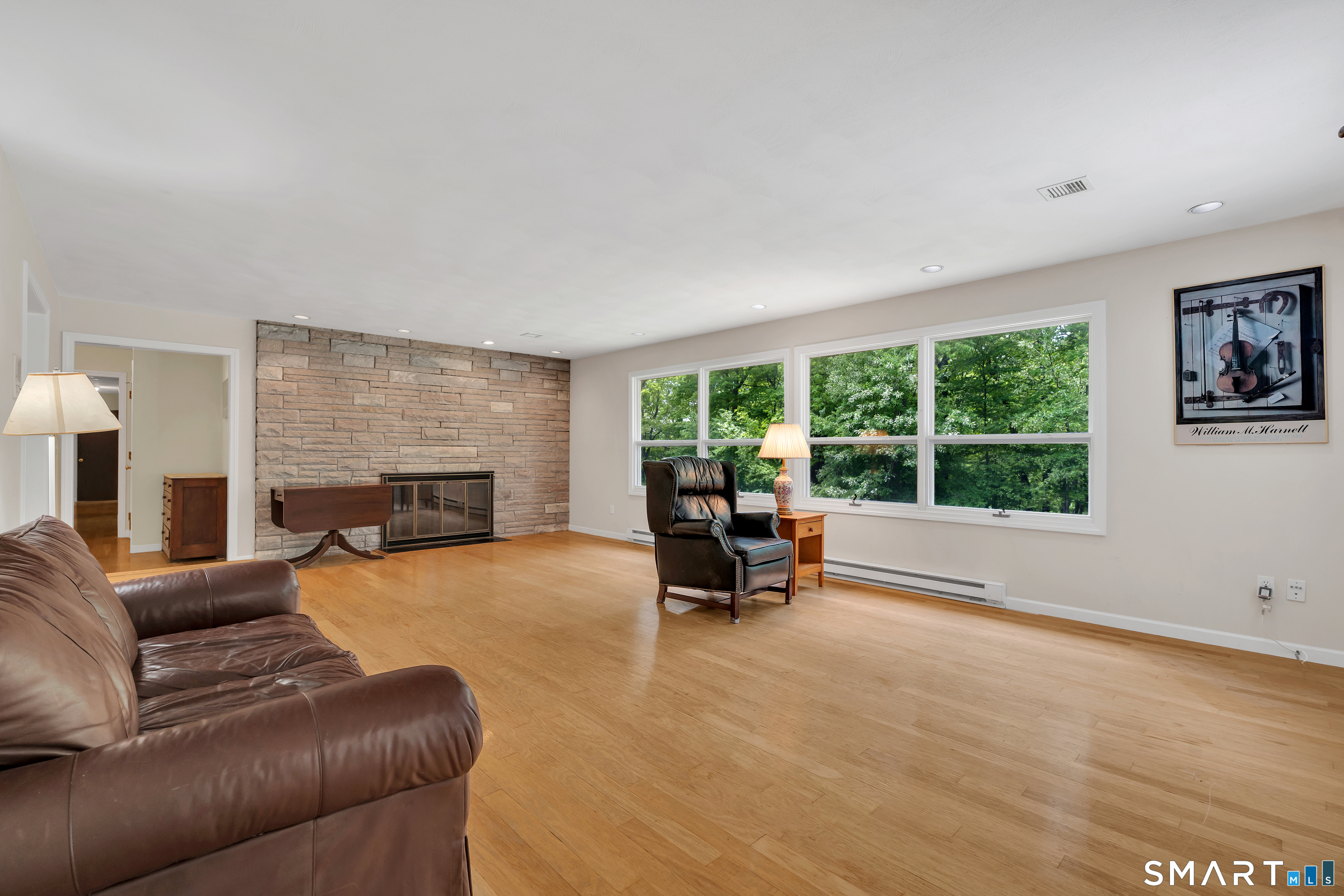 30 Maltbie Road Newtown, CT 06470 - Photo 24 of 40 a living room with furniture and a fireplace