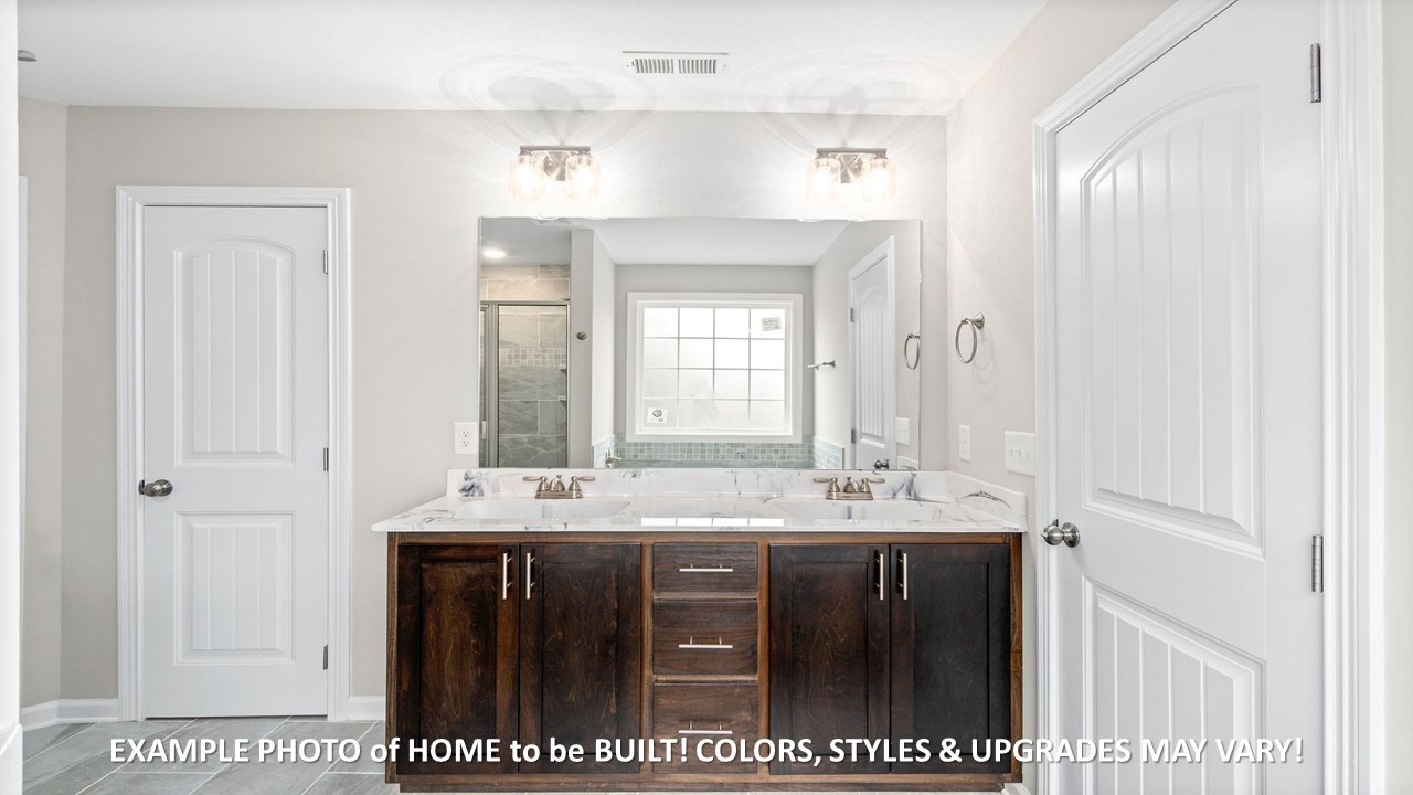 1830 McWhorter Road Cunningham, TN 37052 - Photo 18 of 46 a bathroom with a sink and a mirror