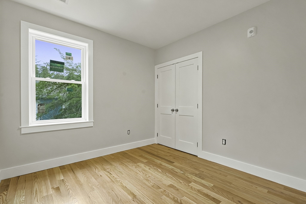 4 Mayhew Street Framingham, MA 01702 - Photo 11 of 42 a view of empty room with wooden floor and fan