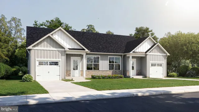 a view of a yard in front view of a house