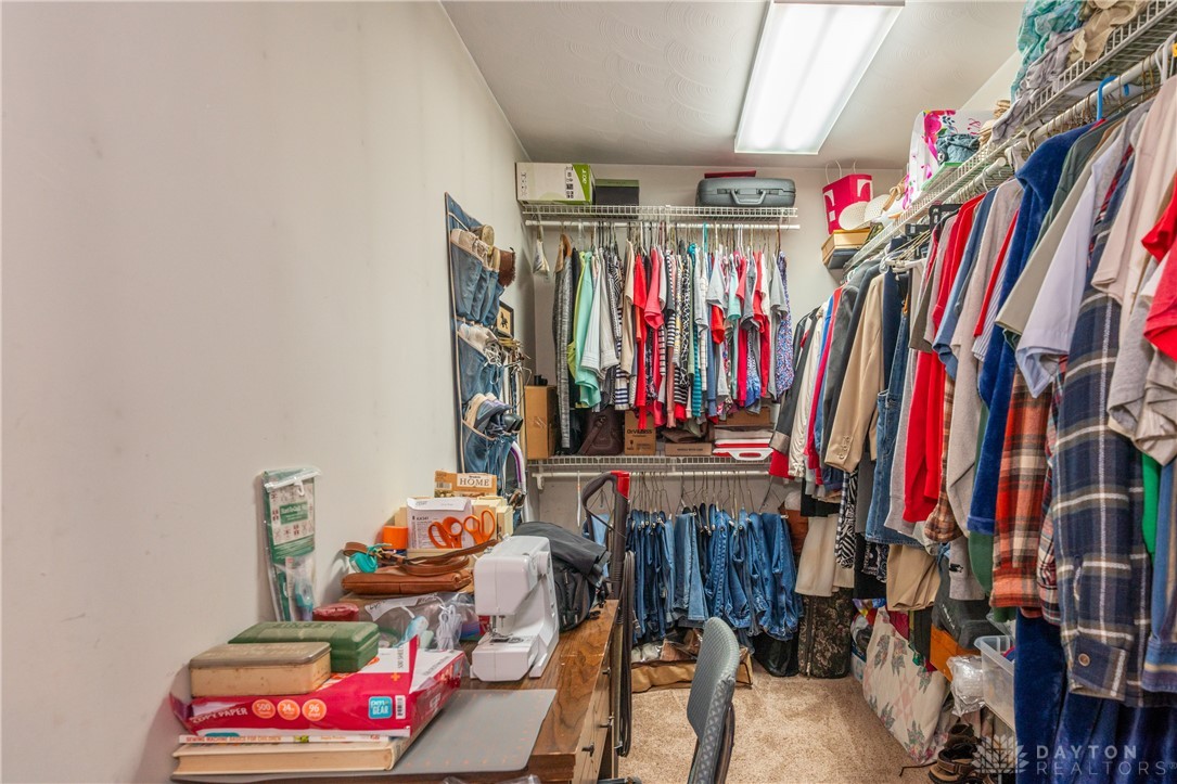 1599 Garringer Road Jamestown, OH 45335 - Photo 20 of 73 This walk-in closet offers extensive storage solutions with built-in shelving and ample hanging space.