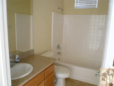 49590 Lewis Road Indio, CA 92201 - Photo 15 of 20 a bathroom with a sink a toilet and bathtub