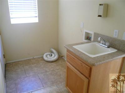 49590 Lewis Road Indio, CA 92201 - Photo 16 of 20 a bathroom with a sink and a vanity