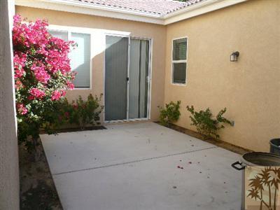 49590 Lewis Road Indio, CA 92201 - Photo 19 of 20 a potted plant sitting in front of a house