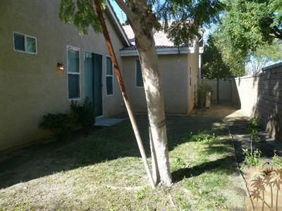 49590 Lewis Road Indio, CA 92201 - Photo 20 of 20 a front view of a house with a yard