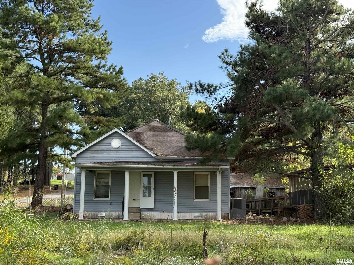 967 Bunker Street Equality, IL 62934 - Photo 19 of 23 a front view of a house with garden