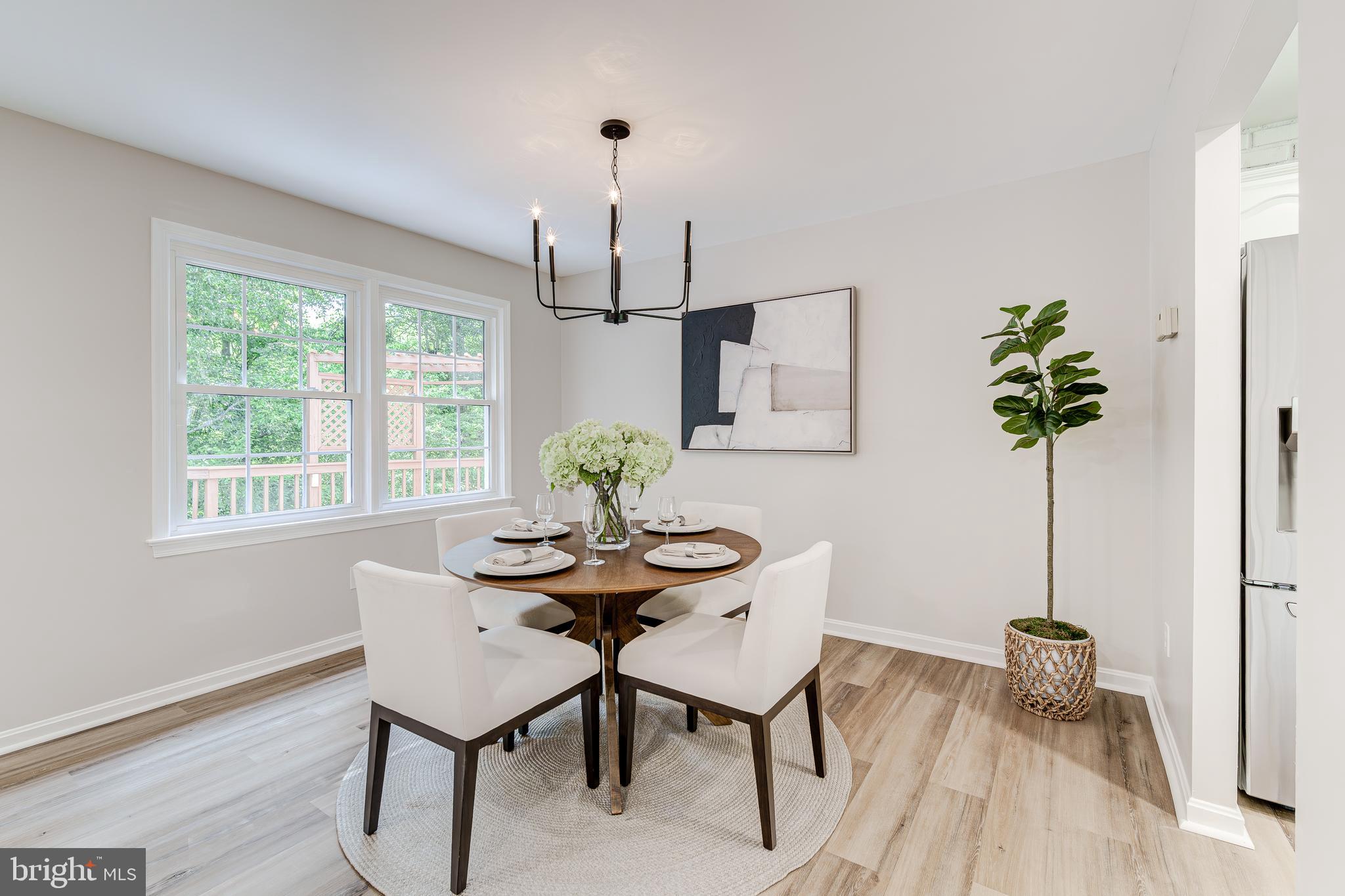 6803 Houndmaster Road Springfield, VA 22152 - Photo 12 of 44 a view of a dining room with furniture and window
