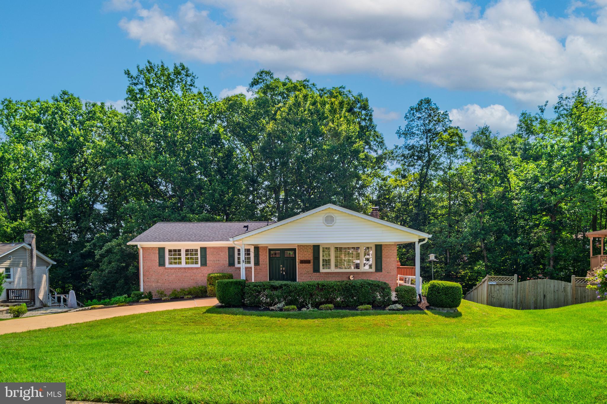 6803 Houndmaster Road Springfield, VA 22152 - Photo 2 of 44 a front view of a house with garden