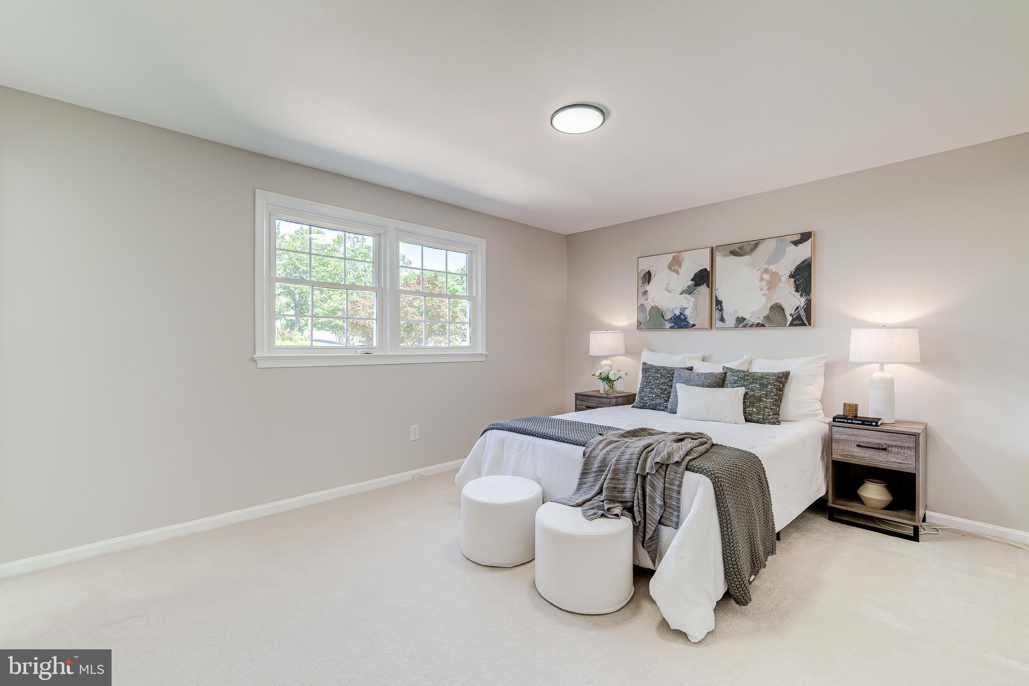 6803 Houndmaster Road Springfield, VA 22152 - Photo 21 of 44 a bedroom with bed and a window