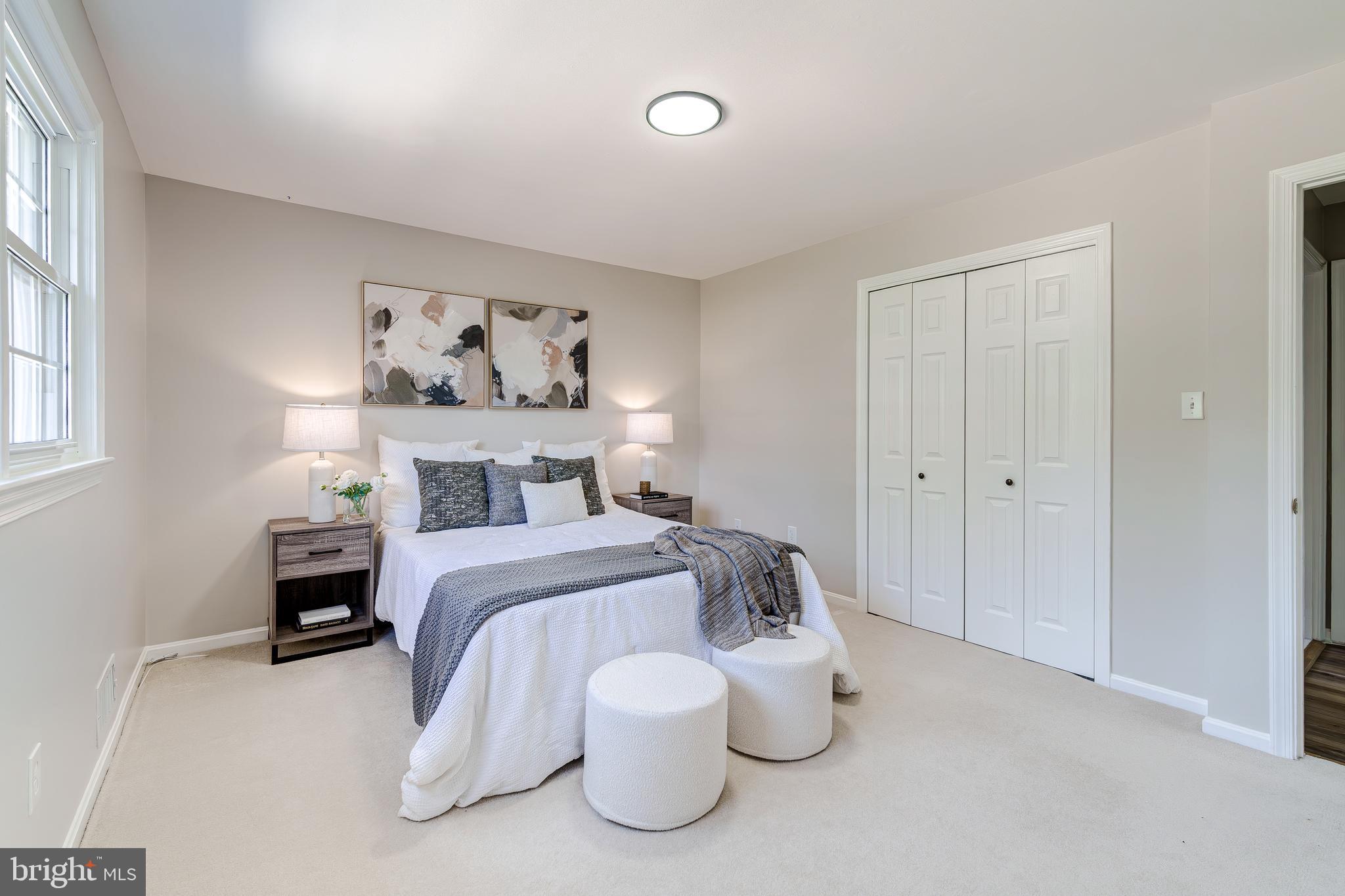6803 Houndmaster Road Springfield, VA 22152 - Photo 22 of 44 a bed room with a bed and furniture