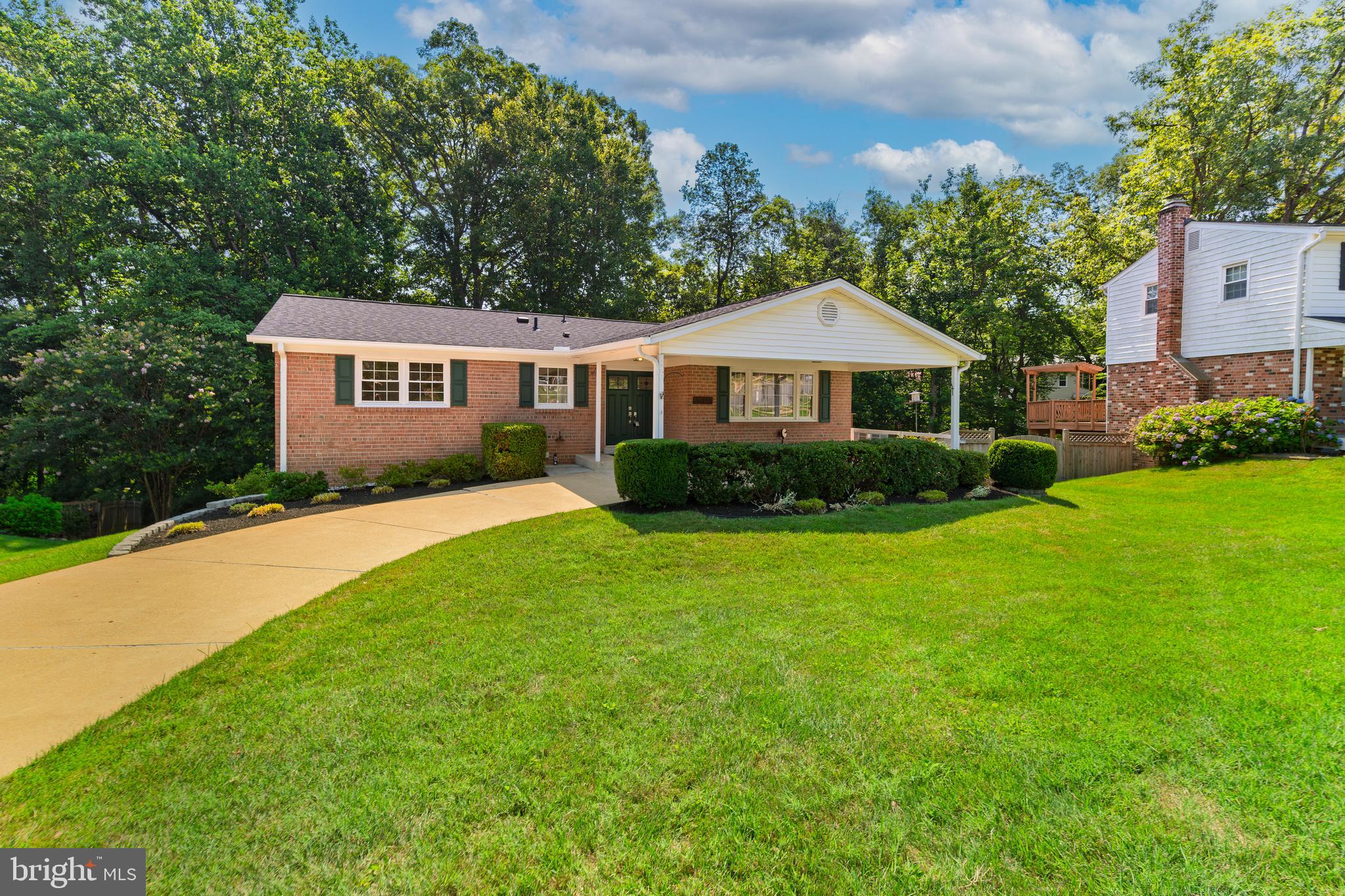 6803 Houndmaster Road Springfield, VA 22152 - Photo 3 of 44 a front view of house with yard and green space