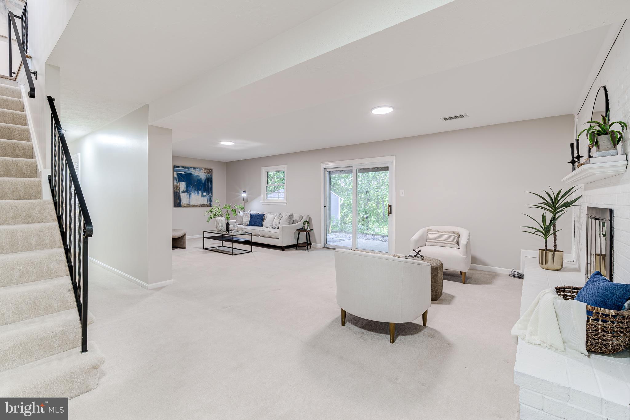 6803 Houndmaster Road Springfield, VA 22152 - Photo 36 of 44 a living room with furniture and a large window