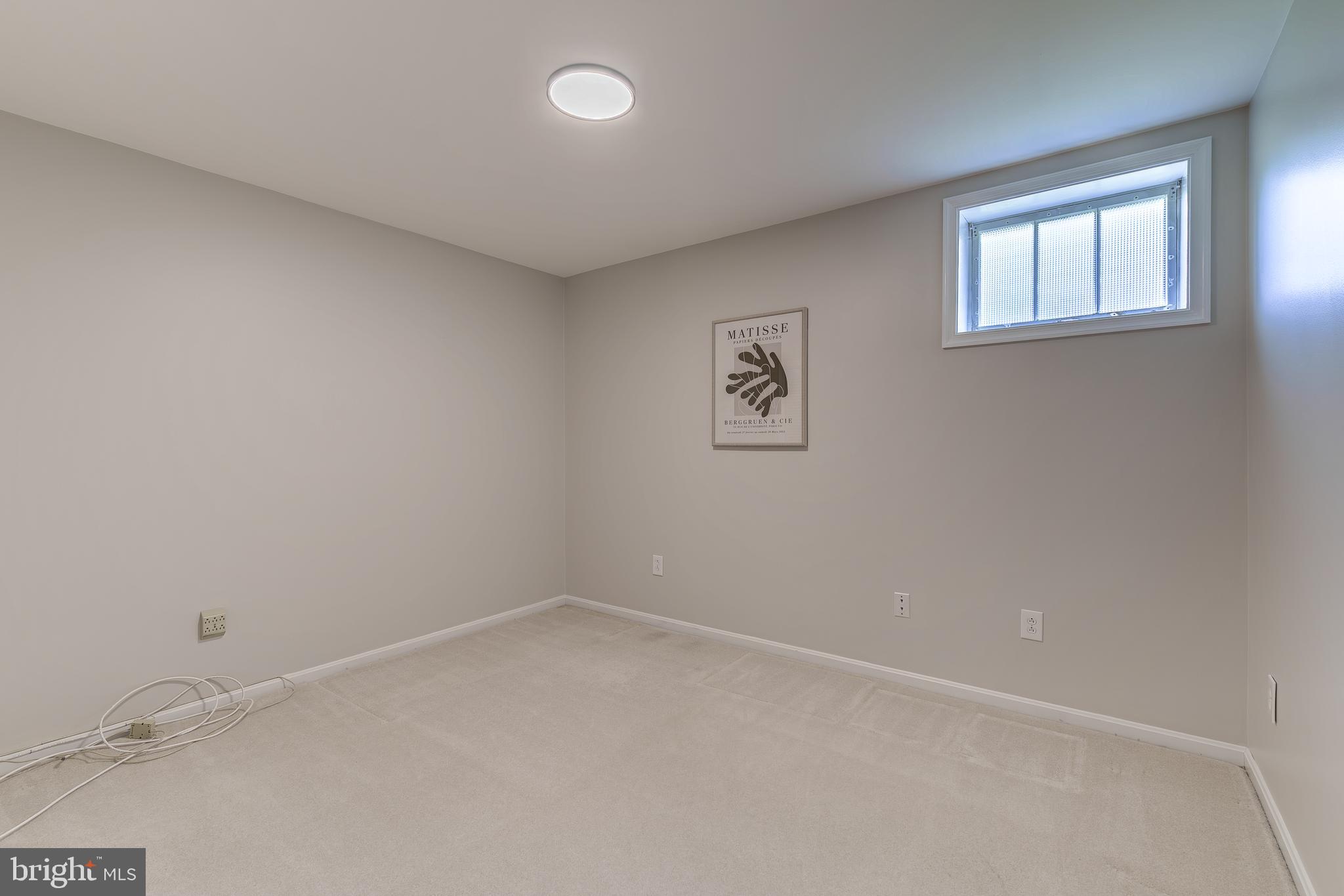 6803 Houndmaster Road Springfield, VA 22152 - Photo 38 of 44 an empty room with a window