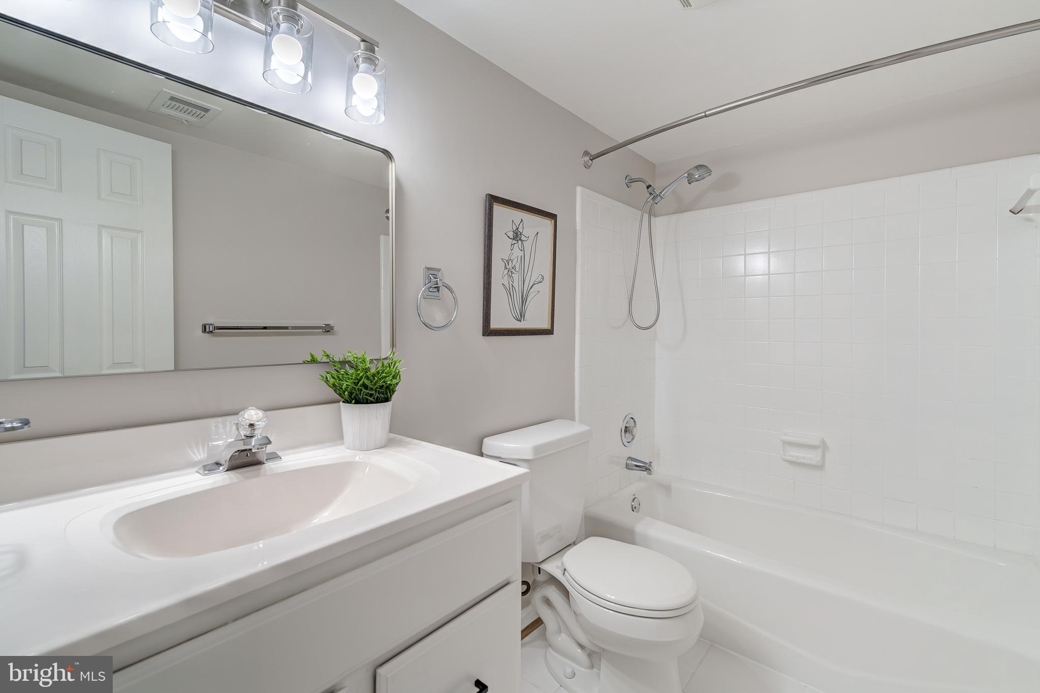 6803 Houndmaster Road Springfield, VA 22152 - Photo 39 of 44 a bathroom with a sink toilet and shower