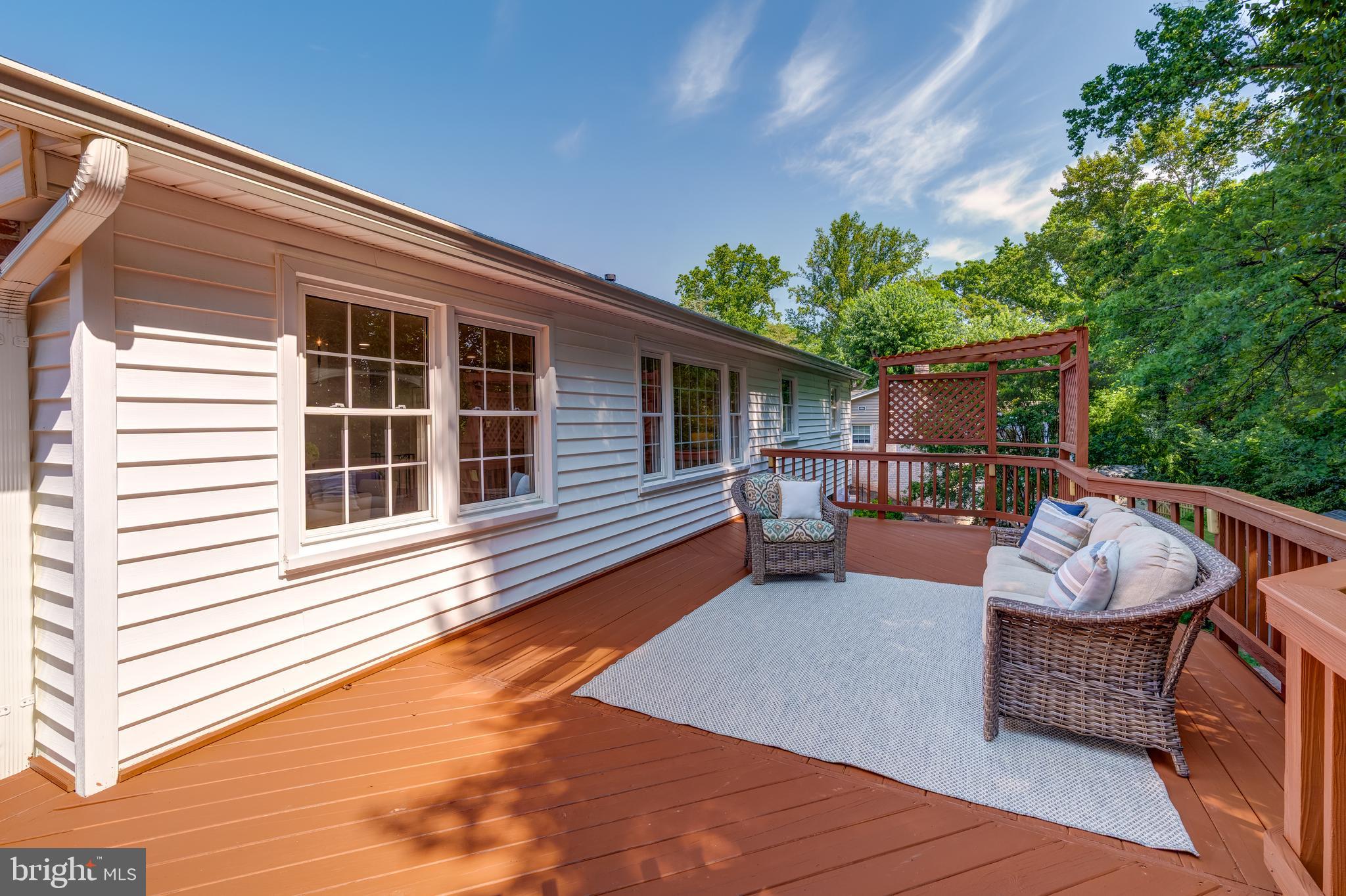 6803 Houndmaster Road Springfield, VA 22152 - Photo 41 of 44 a balcony with furniture and a potted plant