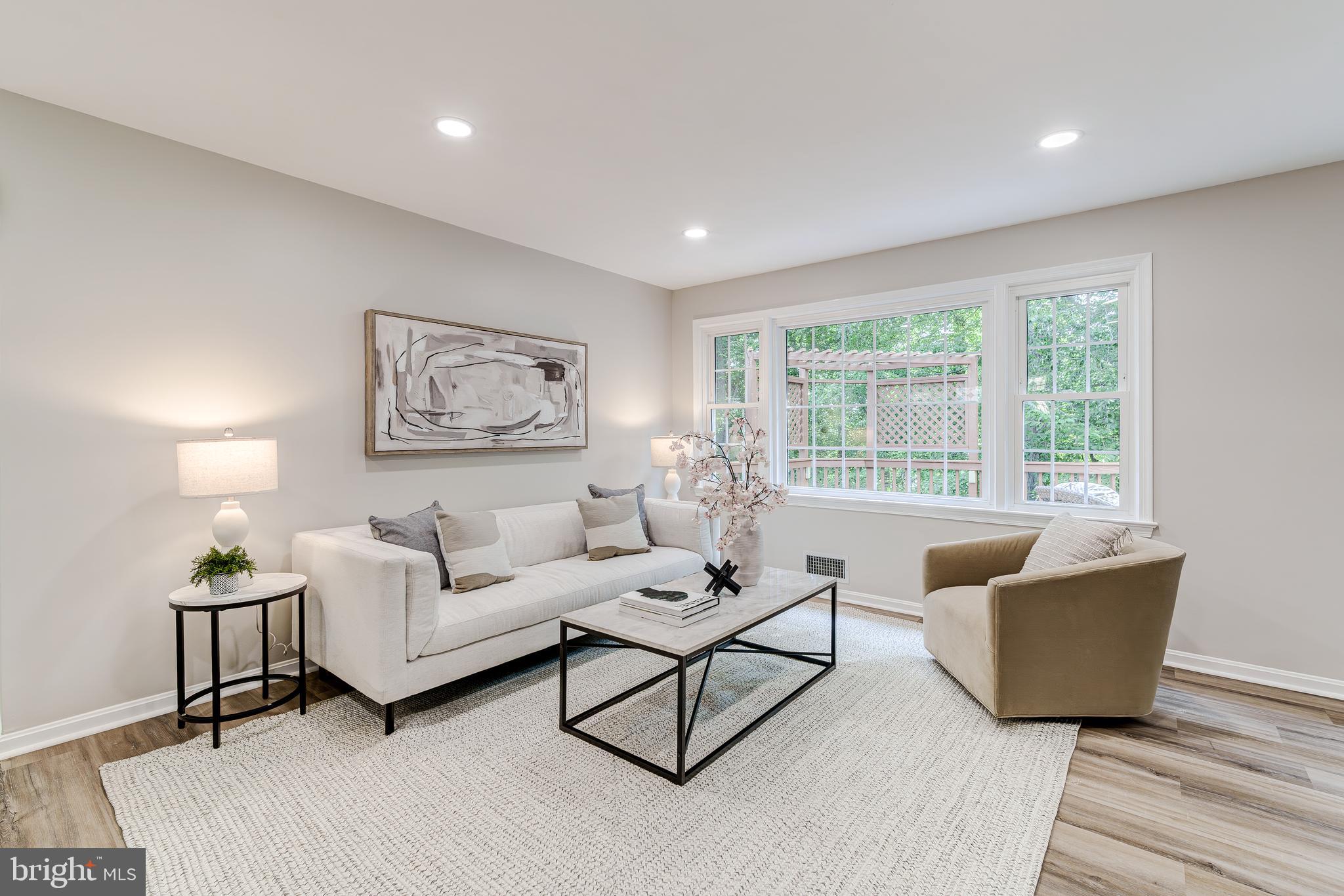 6803 Houndmaster Road Springfield, VA 22152 - Photo 8 of 44 a living room with furniture and a large window