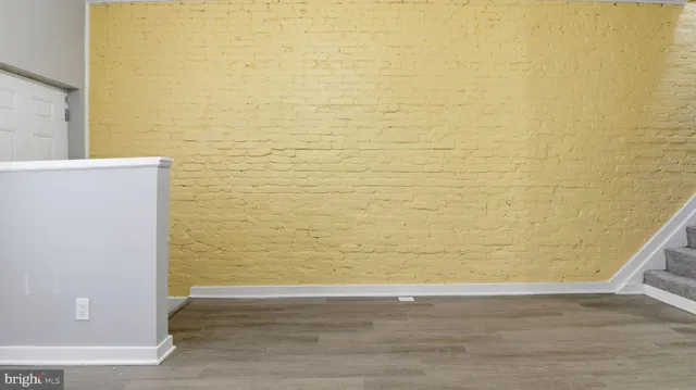 a view of empty room with wooden walls