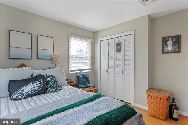 a living room with furniture and a ceiling fan