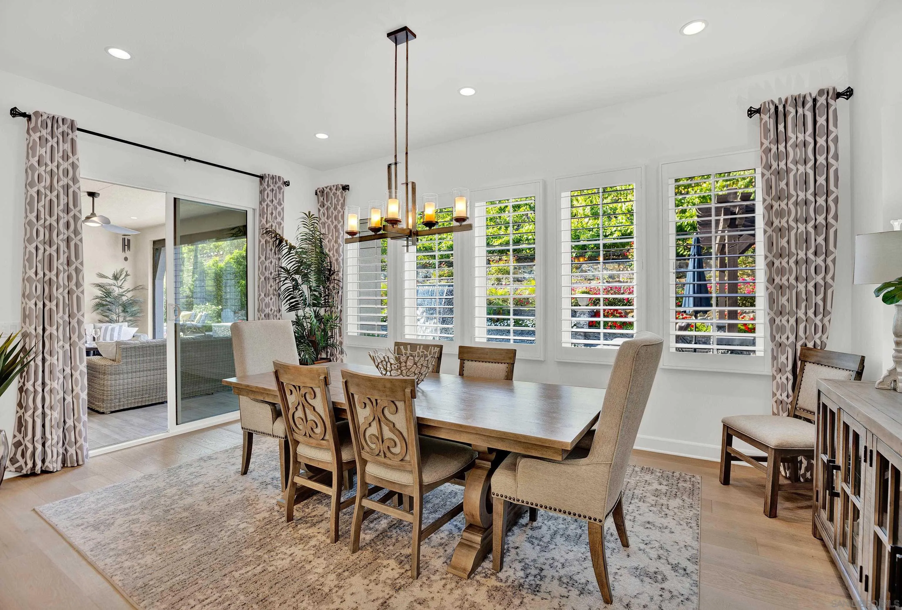 946 Pearl Drive San Marcos, CA 92078 - Photo 11 of 42 a view of a dining room with furniture window and wooden floor