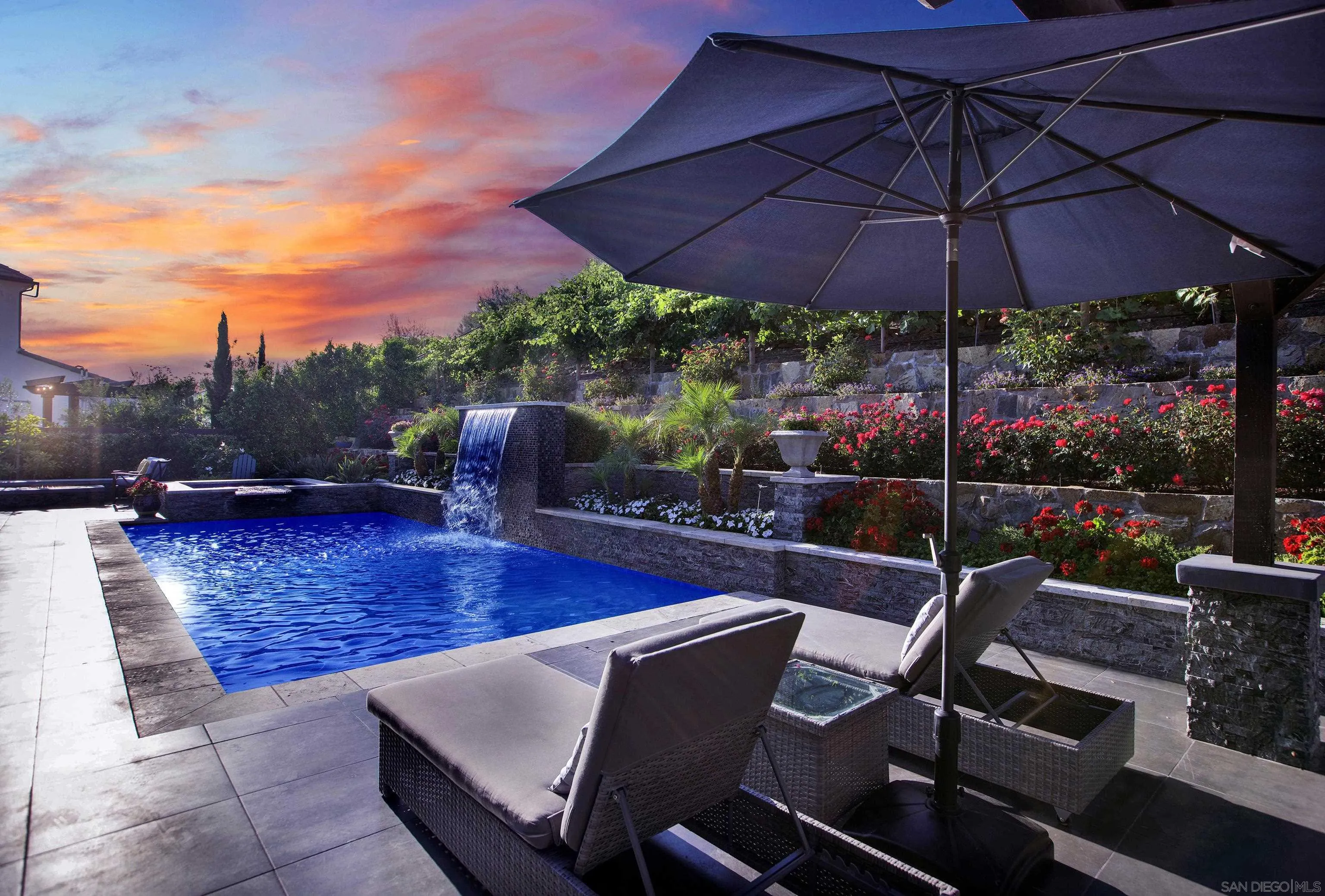 946 Pearl Drive San Marcos, CA 92078 - Photo 15 of 42 a view of a patio with a table chairs and a fire pit