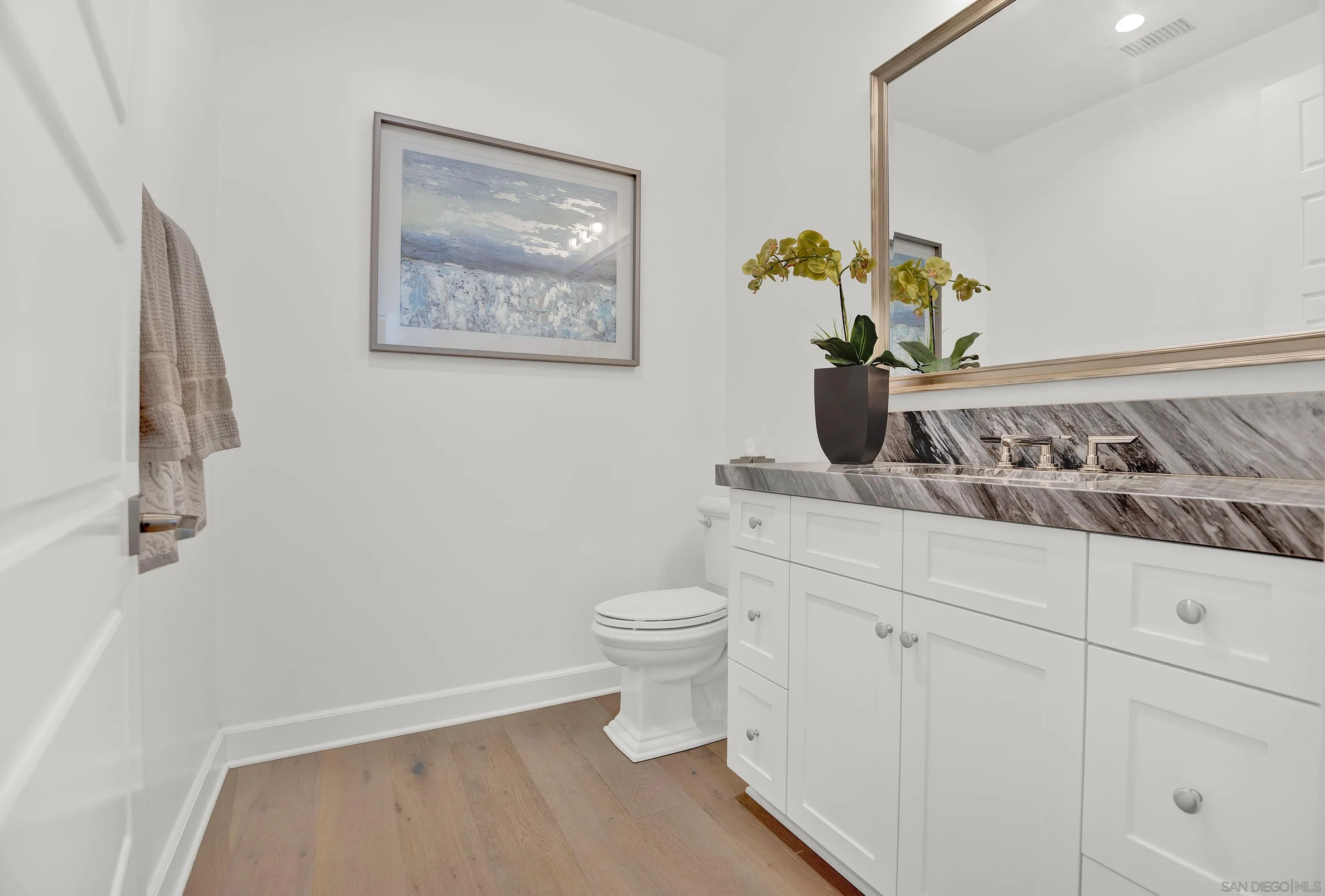 946 Pearl Drive San Marcos, CA 92078 - Photo 23 of 42 a bathroom with a toilet and a sink