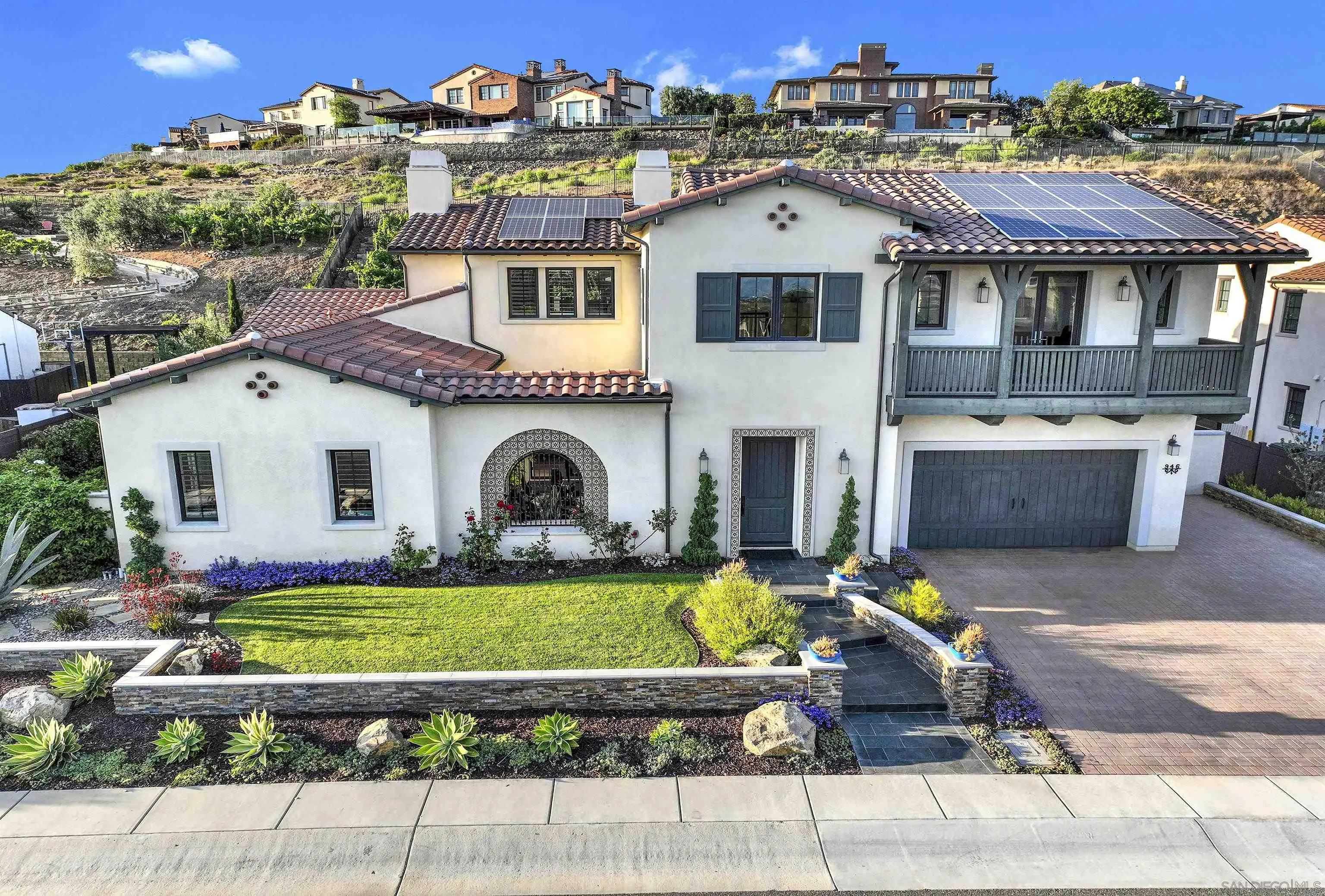 946 Pearl Drive San Marcos, CA 92078 - Photo 28 of 42 a front view of a house with a garden and a tree