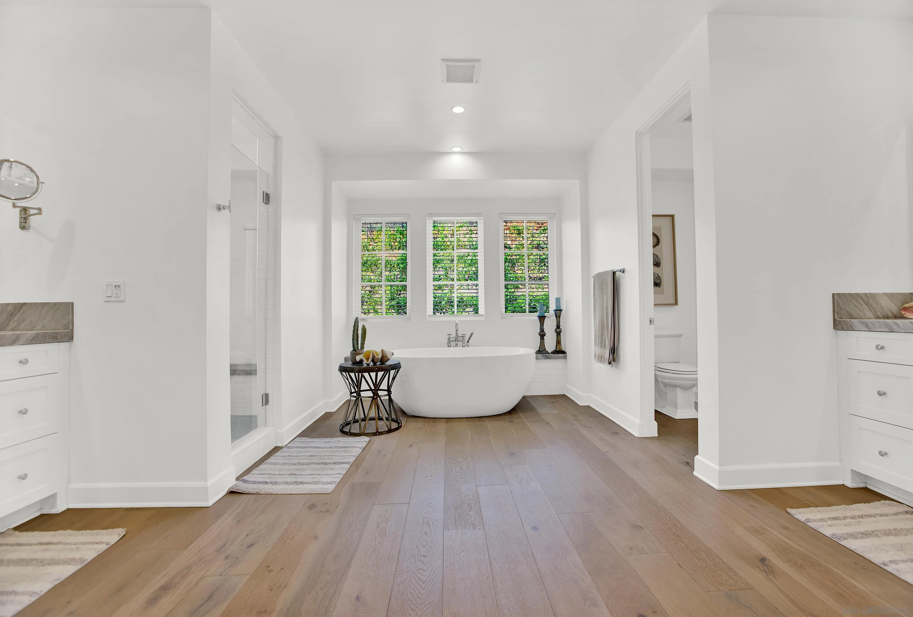 946 Pearl Drive San Marcos, CA 92078 - Photo 33 of 42 a spacious bedroom with a large window and a wooden floor
