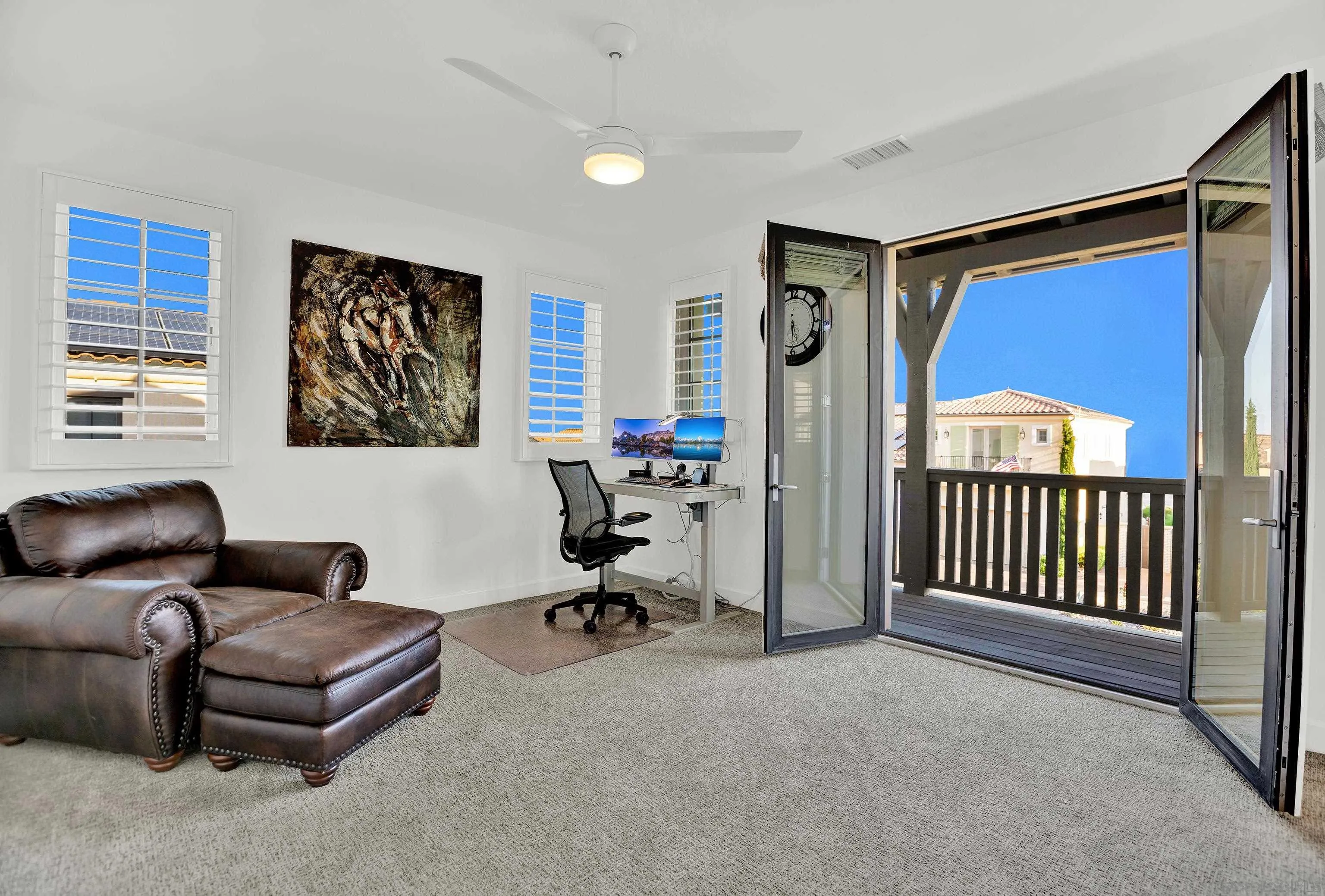 946 Pearl Drive San Marcos, CA 92078 - Photo 34 of 42 a living room with furniture ceiling fan and a window