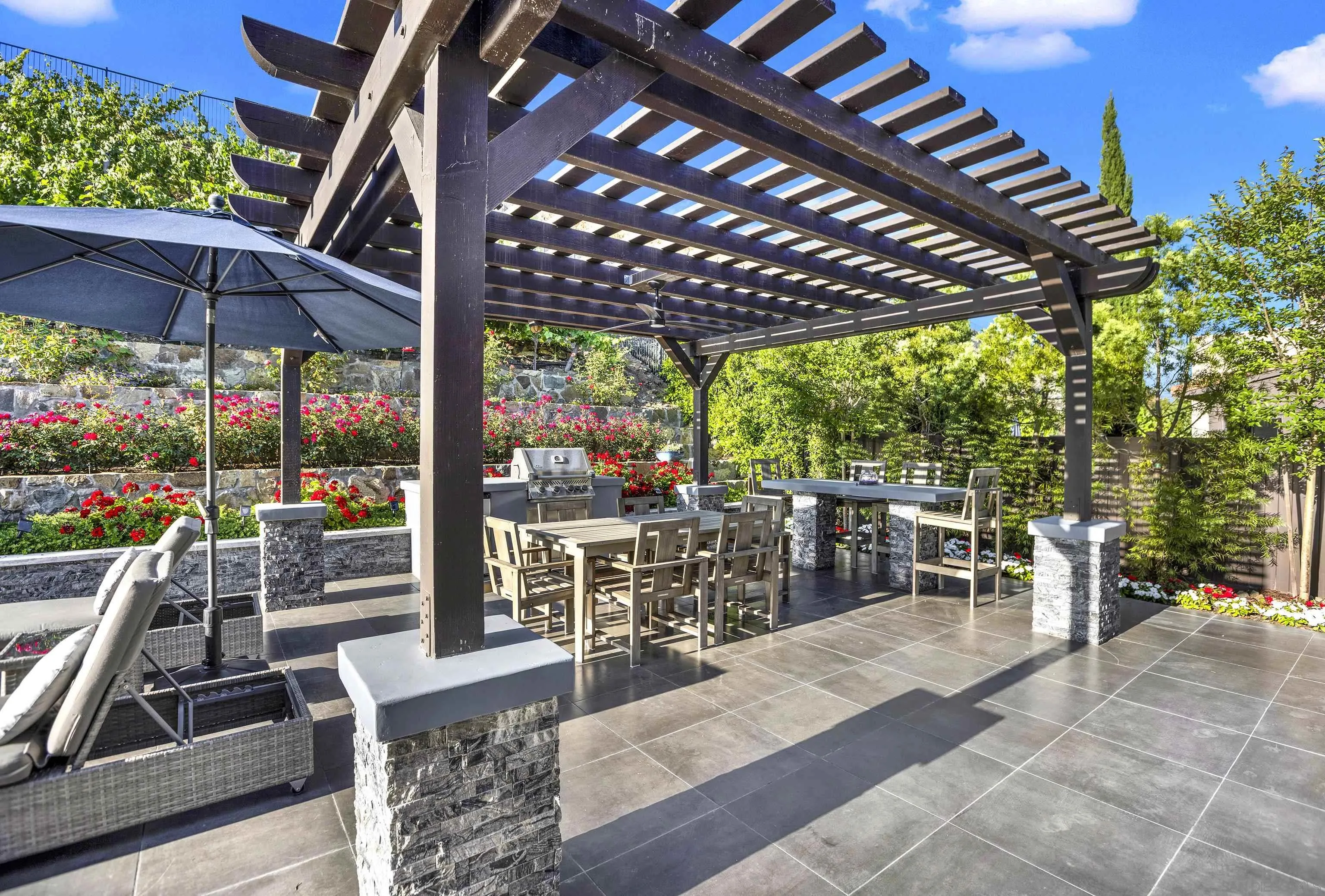 946 Pearl Drive San Marcos, CA 92078 - Photo 39 of 42 a view of a patio with a table chairs and a porch