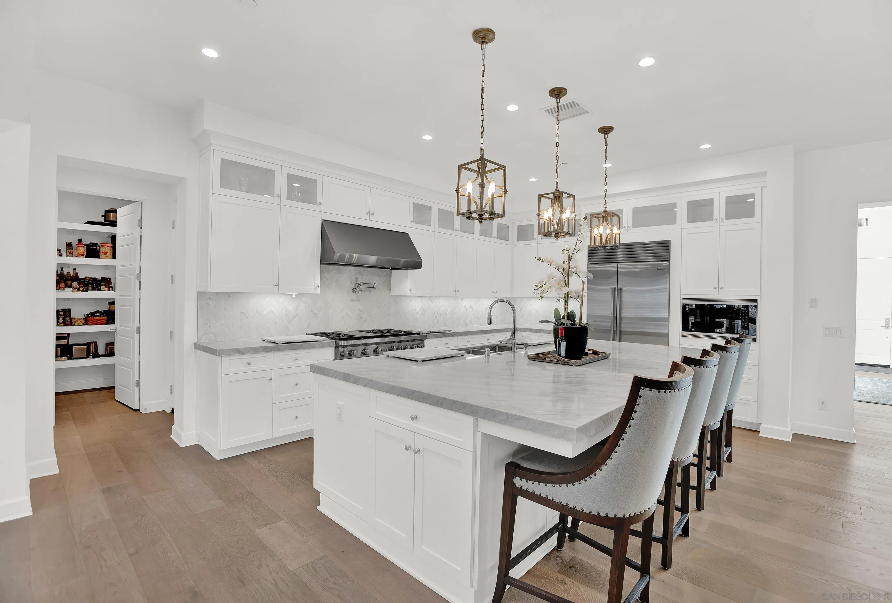 946 Pearl Drive San Marcos, CA 92078 - Photo 7 of 42 a large kitchen with a table and chairs