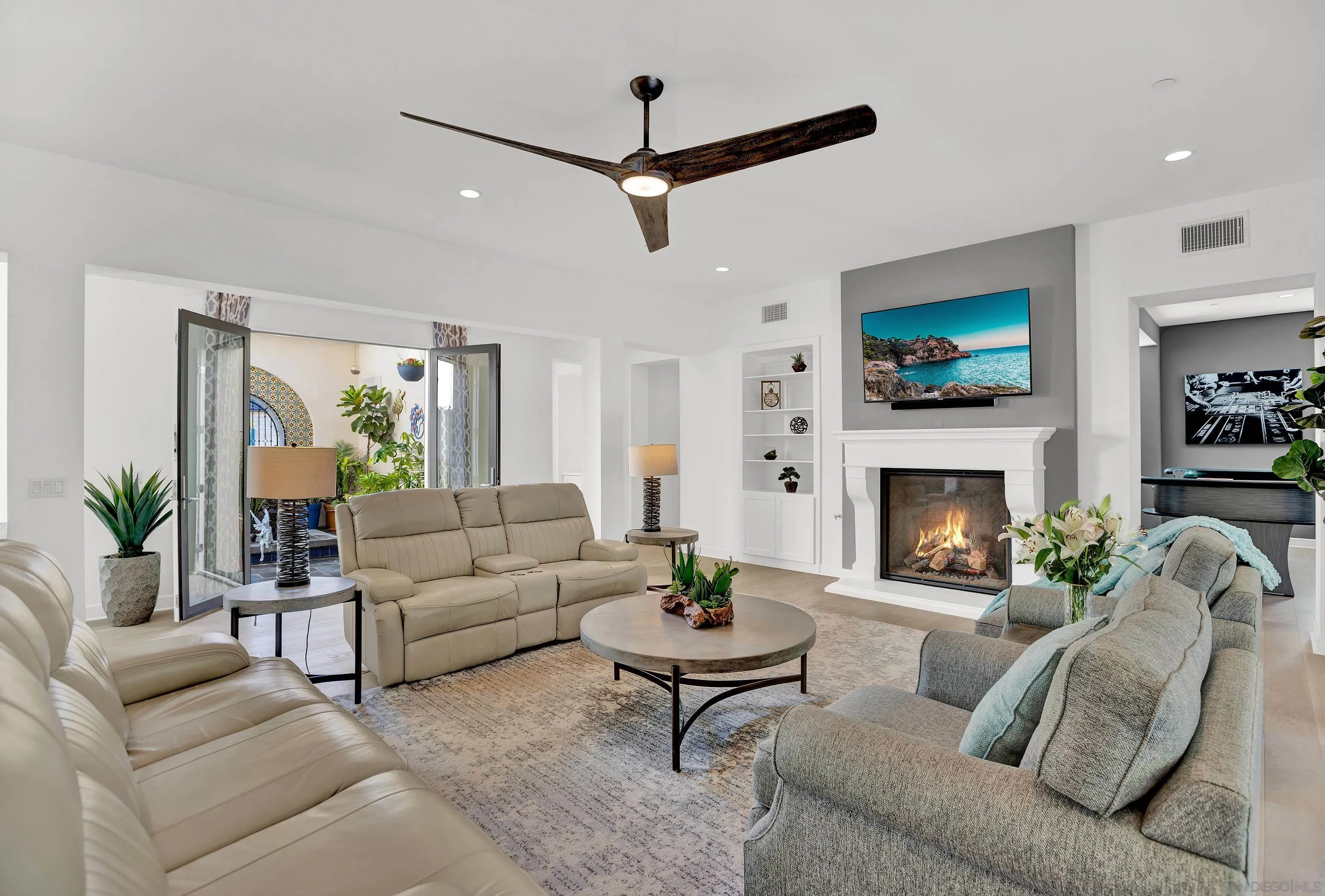 946 Pearl Drive San Marcos, CA 92078 - Photo 10 of 42 a living room with furniture a flat screen tv and a fireplace