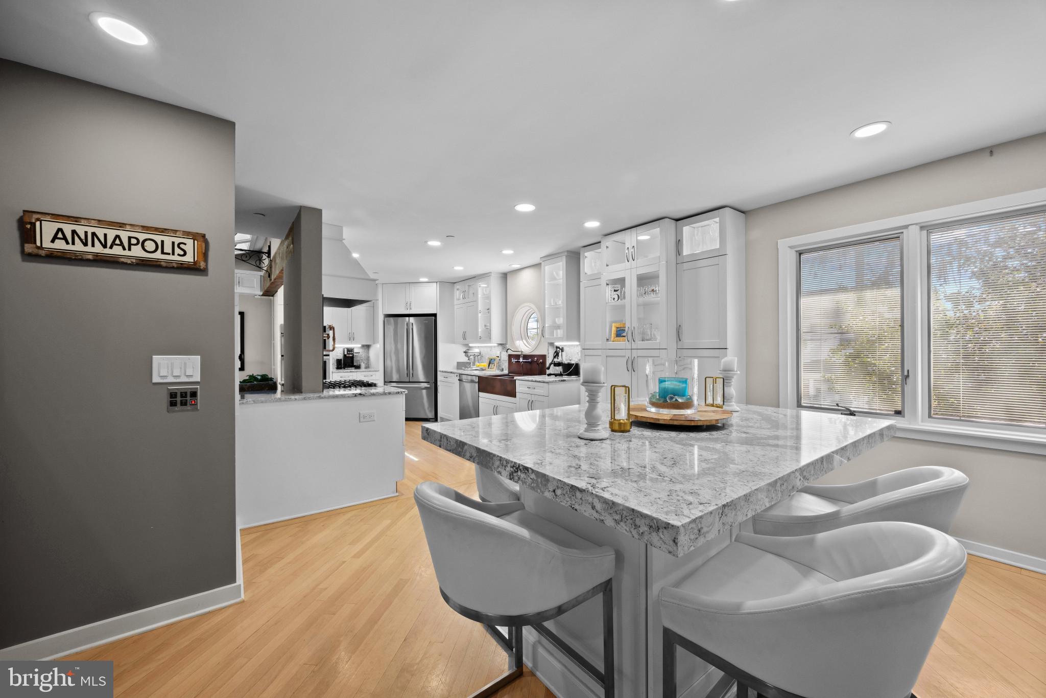619 Second Street Annapolis, MD 21403 - Photo 12 of 40 Island with seating and kitchen beyond