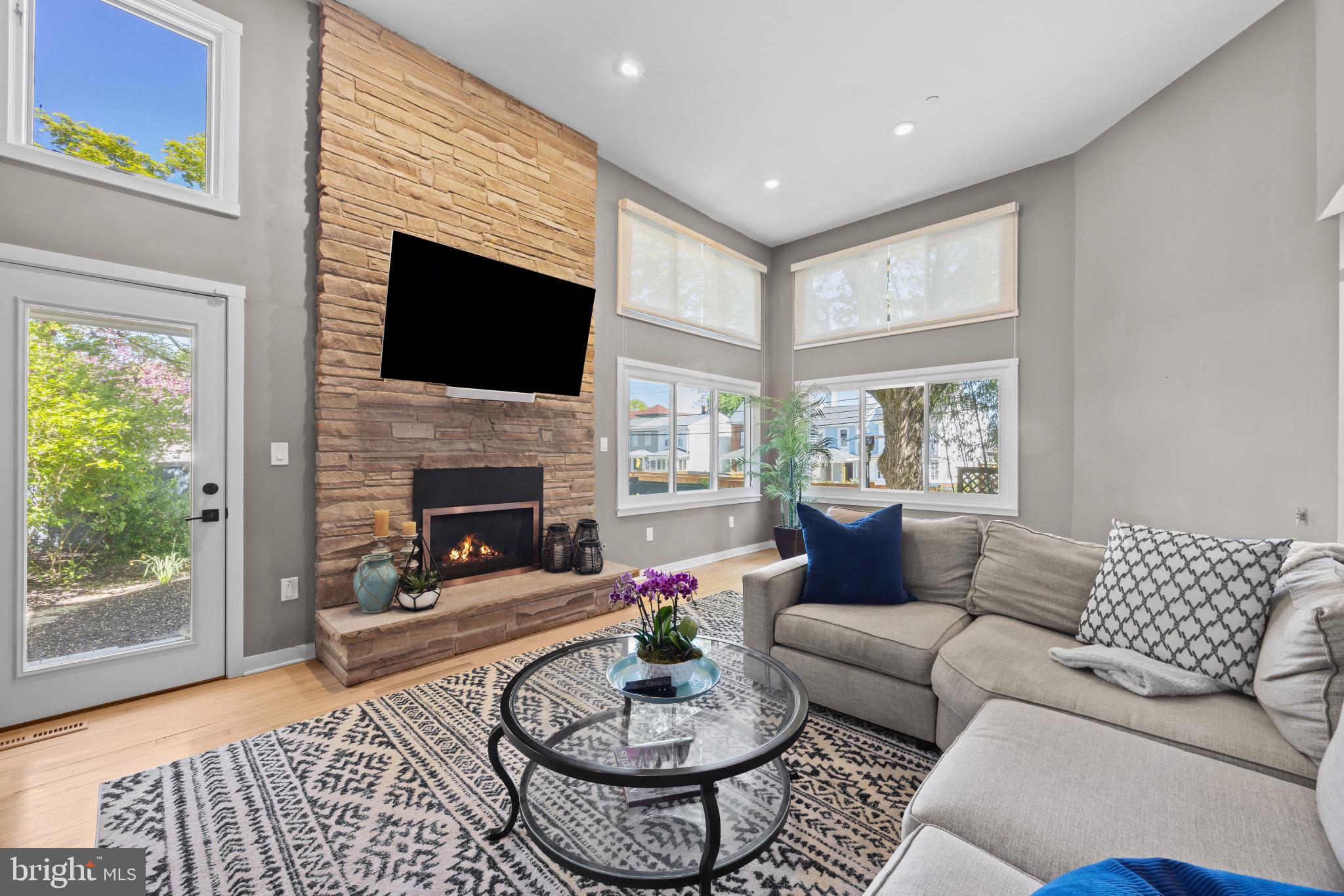 619 Second Street Annapolis, MD 21403 - Photo 6 of 40 Living room with tall ceilings and fireplace