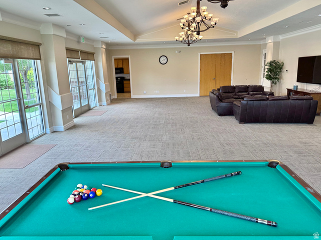 1204 South 1150th Street West Payson, UT 84651 - Photo 21 of 26 Clubhouse common area featuring a billiards table, vaulted ceiling with chandelier, multiple sets of glass French doors, and patterned carpet flooring