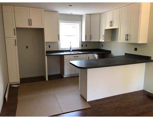 487 Mason Road Ashby, MA 01431 - Photo 11 of 12 a kitchen with a sink a stove a refrigerator and white cabinets