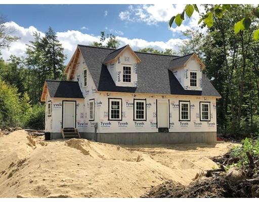 487 Mason Road Ashby, MA 01431 - Photo 2 of 12 a front view of a house with a yard covered in snow