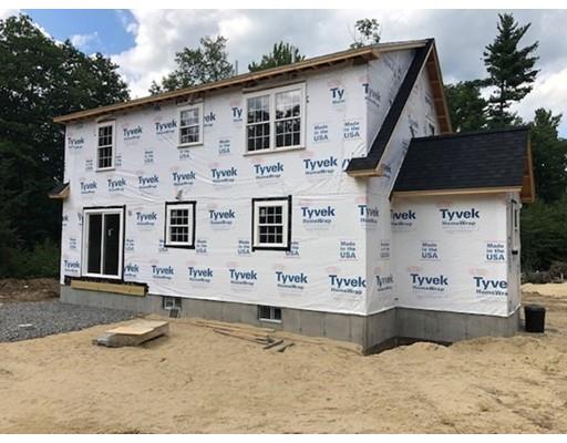 487 Mason Road Ashby, MA 01431 - Photo 7 of 12 a view of a white house with large windows
