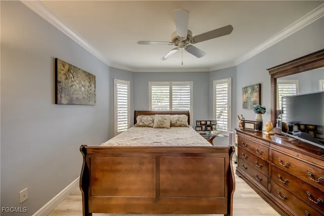 a room with a bed and a flat screen tv