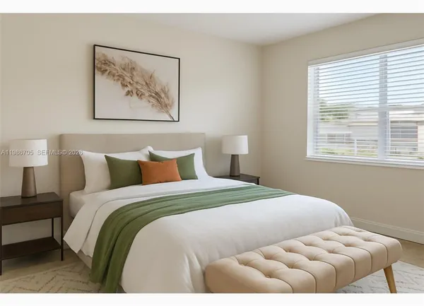 a bedroom with bed and a painting