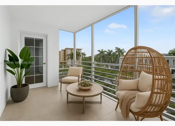 a view of a livingroom with furniture and potted plants