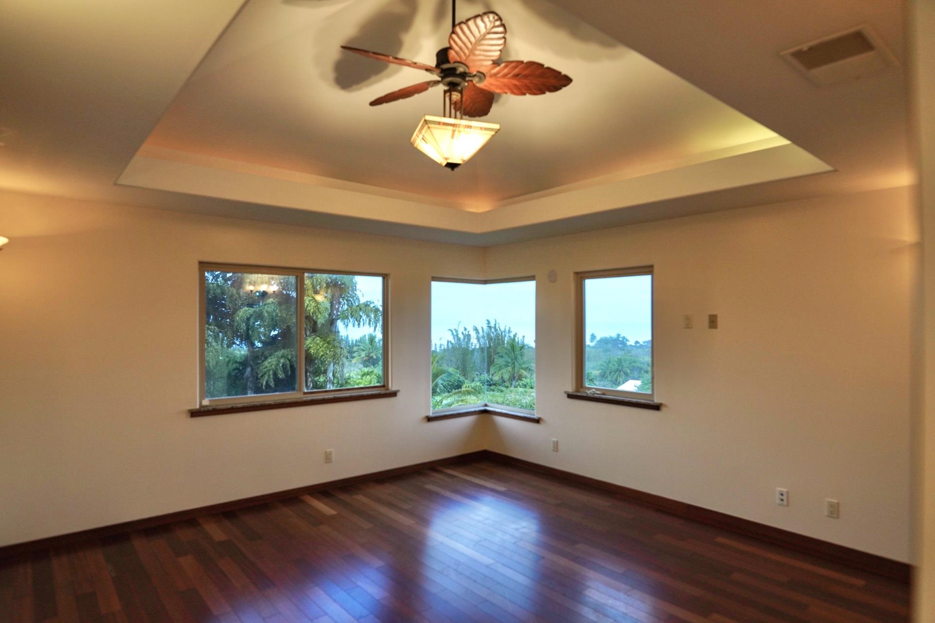 43 West Waipio Road Haiku, HI 96708 - Photo 20 of 44 a view of an empty room with wooden floor and a window